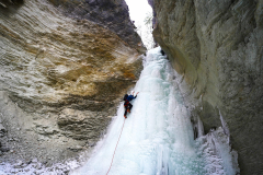 Honourable Mention, 2025 Activity in Winter - Jim Everard: Blair Piggot heading upstream, Rocky Mtns