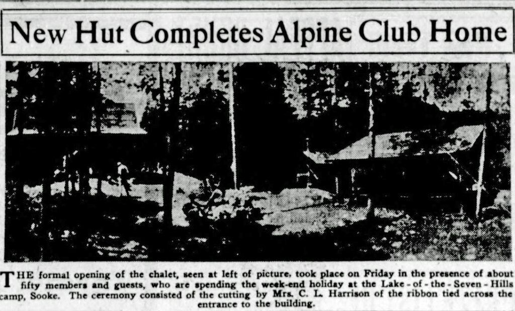 The formal opening of the chalet, seen at left of picture, took place on Friday in the presence of about fifty members and guests, who are spending the week-end holiday at Lake-of-the-Seveh-Hills camp, Sooke. The ceremony consisted of the cutting by Mrs. C. L. Harrison of the ribbon tied across the entrance to the building.