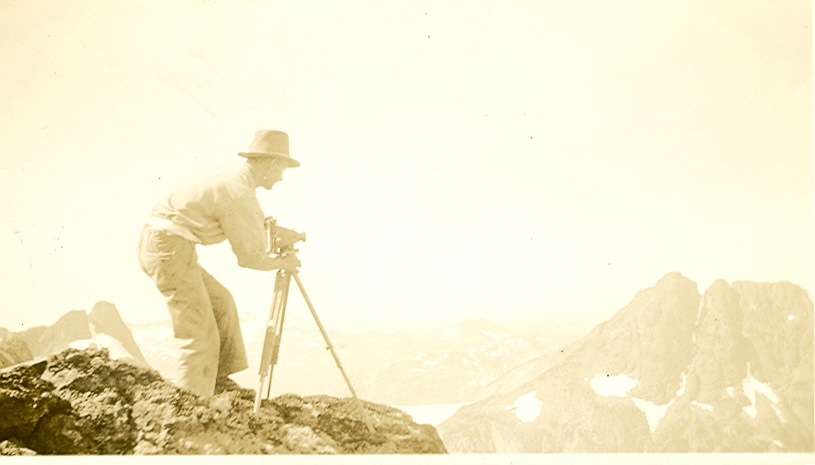 Norman Stewart surveying on the summit of the Comox Glacier 1934 – Bill Bell photo