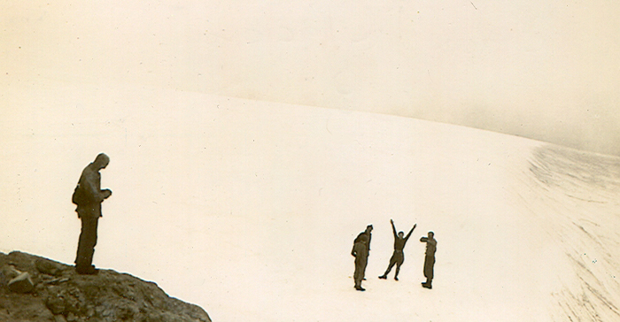Ruth Masters waving her arms on the Comox Glacier 1938.