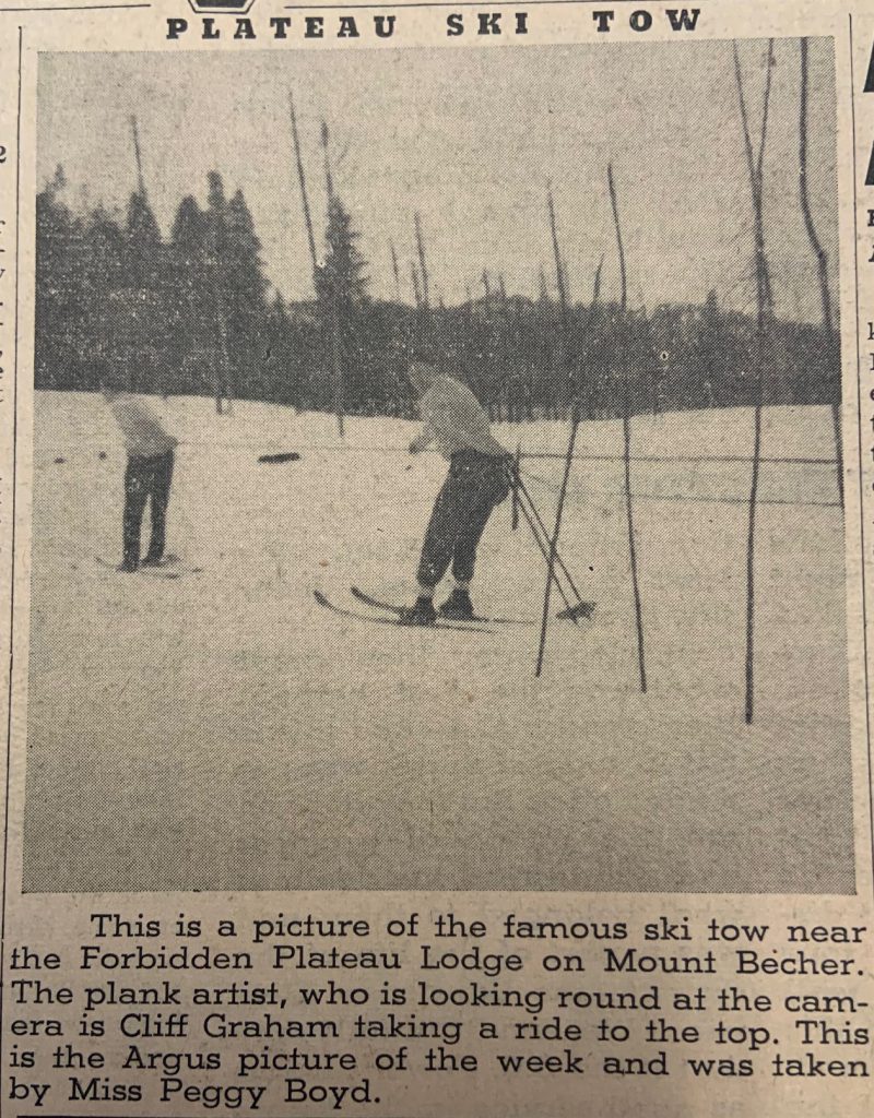 This is a picture of the famous ski tow near the Forbidden Plateau Lodge on Mount Becher.The plank artist, who is looking round at the camera is Cliff Graham taking a ride to the top. This is the Argus picture of the week and was taken by Miss Peggy Boyd.