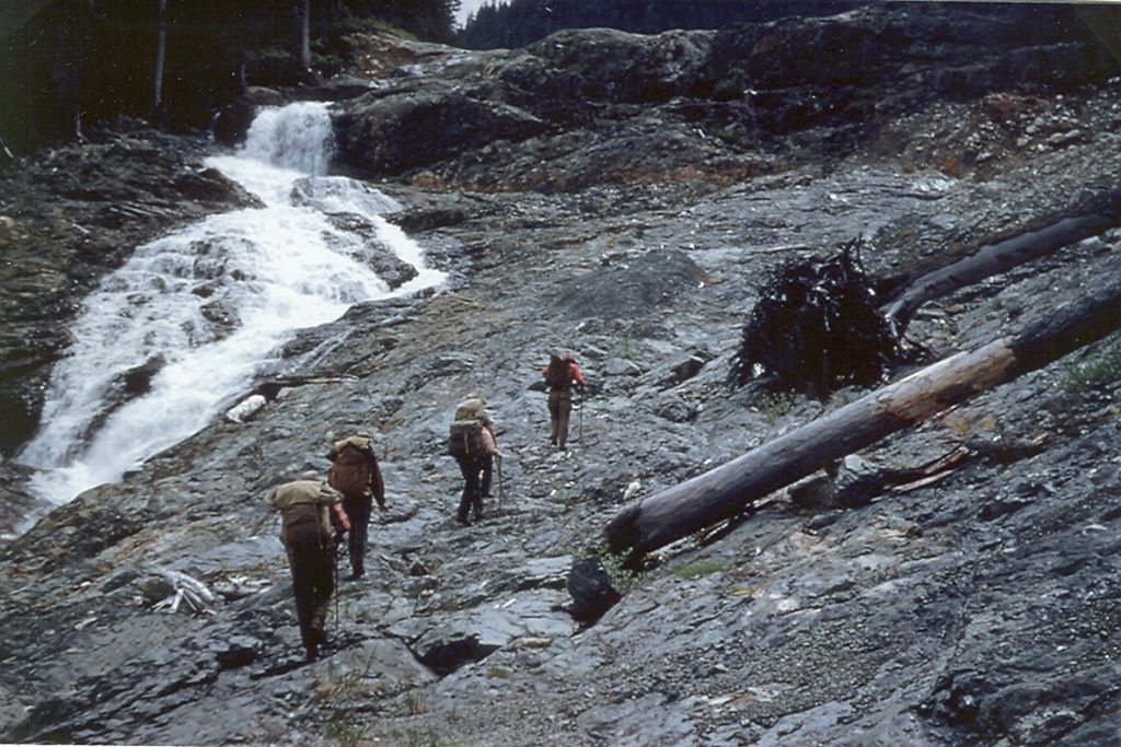 Members of the Alpine Club hiking up the rock beside the Elk River towards Landslide Lake 1954 – Patrick Guilbride photo.