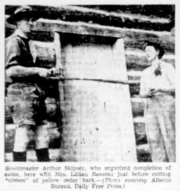 Scoutmaster Arthur Skipsey, who organized completion of cabin, here with Mrs. Lillian Rosseau Just before cutting "ribbon" of yellow cedar bark. — (Photo courtesy Alberni Bureau, Dally Free Press.)