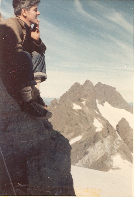 Chuck Smitson on the summit of Rugged Mountain with the Merlon Mountains behind 1959 – George Lepore photo.
