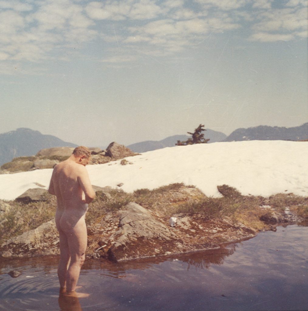 Dave Williamson having a wash in a tarn on the South Ridge of Victoria Peak August 1960 - Frank Stapley photo.