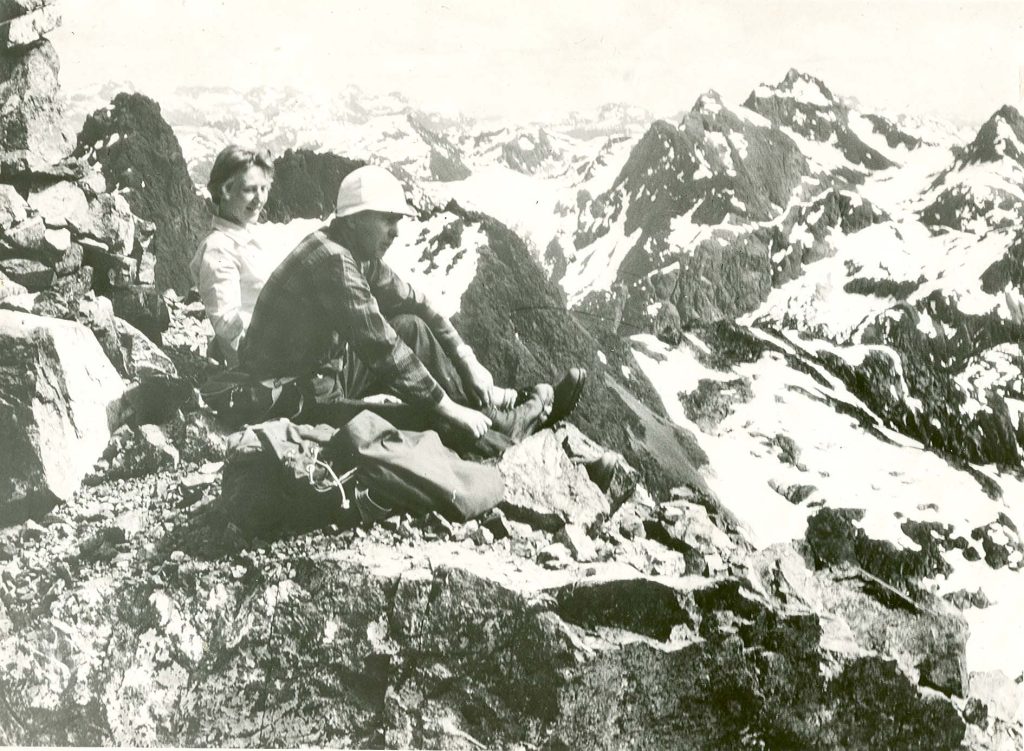 John and Doreen Cowlin sitting on the Southeast Summit of Mt. Colonel Foster, 1966 - Bob Tustin photo.