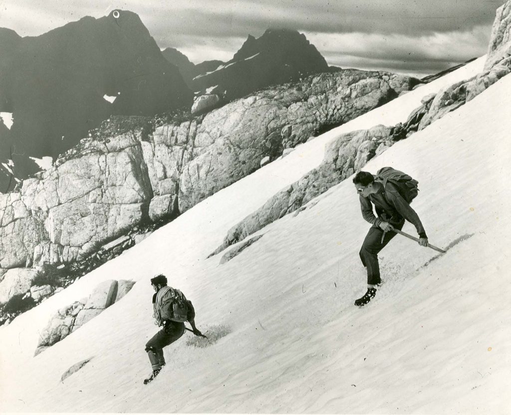 Bob Tustin and Ron Facer glissading off Rambler Peak, 1966. Bob Tustin photo.