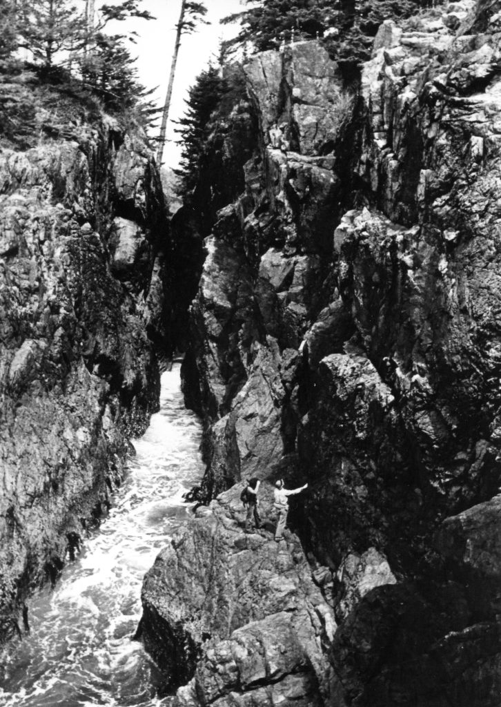 Bill Perry checking out the rock walls at the sea cliffs in Ucluelet 1970s – Bob Tustin photo.