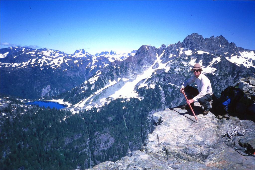 Chris Schreiber with Cream Lake and Mts. Septimus and Rosseau in the background 1987 – Chris Schreiber photo.