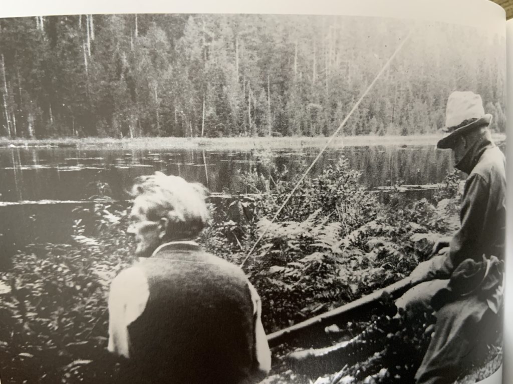 Con Reid and William Reid sitting beside Buttle Lake – William Reid photo.