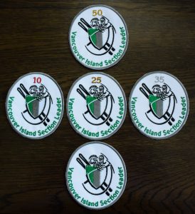 Trip Leader Badges with 50, 10, 25, and 35 to indicate cumulative points achieved. 