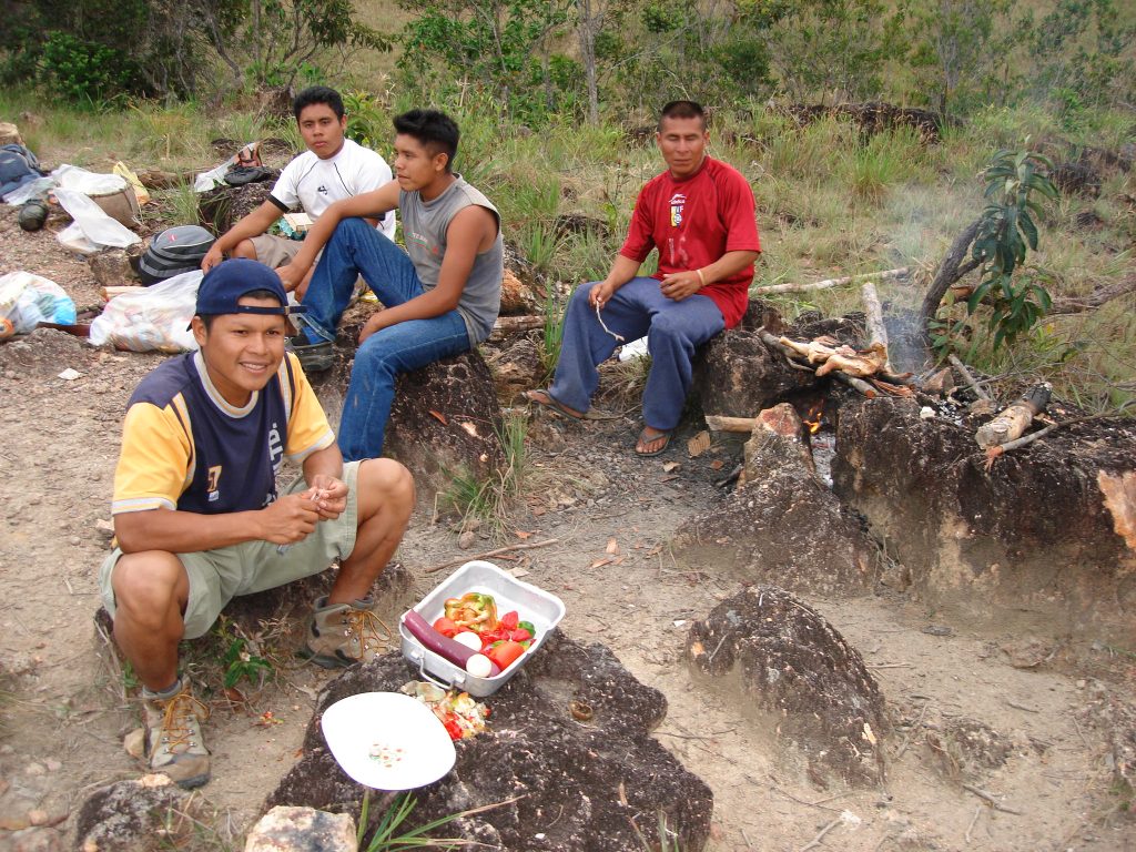 The porters cooking dinner at the camp en route to Mt. Kukenan 2006 – Graham Maddocks photo.