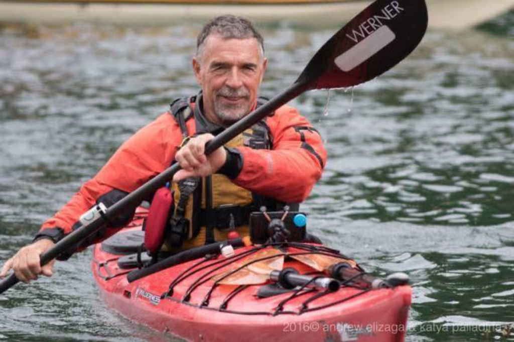 Gary Allen paddling a kayak.
