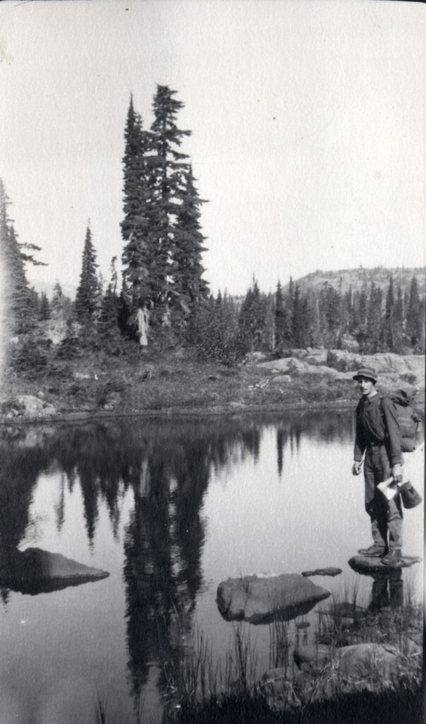 Geoffrey Capes collecting water during 1925 trip to Comox Glacier