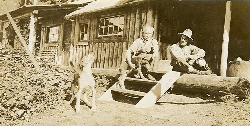 Harry Rogers outside his cabin on Buttle Lake with Jack Horbury 1930s. Brian Ross collection.