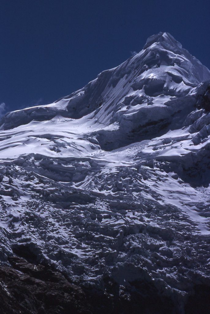 View of Tocllaraju from Nevado Uros with tracks winding through the icefall 1988 – Lindsay Elms photo.