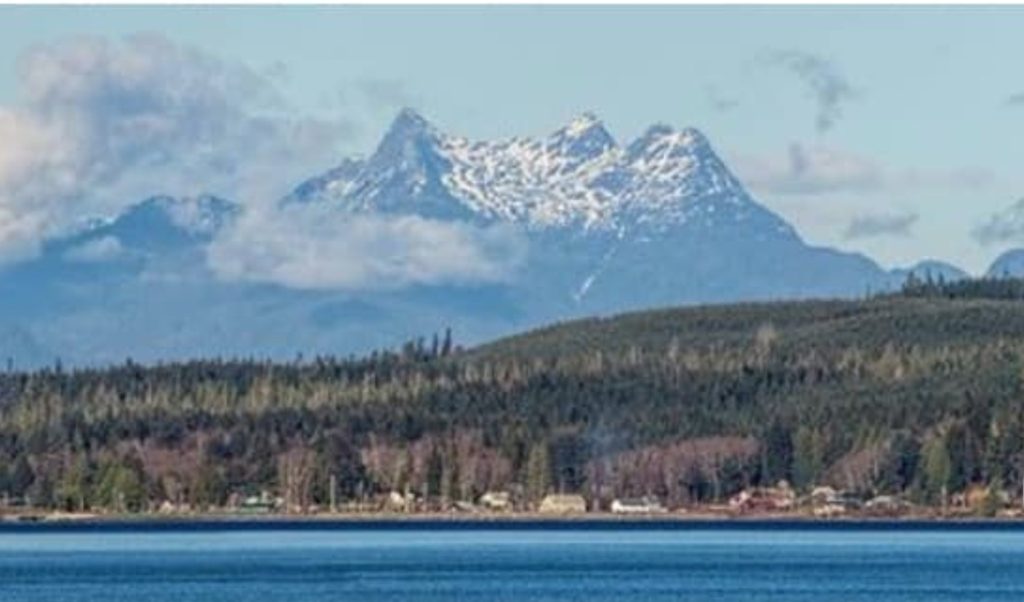 Looking across Malcom Island to Mt. Stephens/k’we (1592m). This is the most conspicuous peak when looking northeast from Port McNeill towards the mainland. It is northeast of Nimmo Bay (off Mackenzie Sound) and west of Kingcome Inlet.