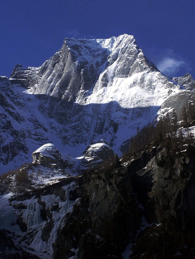The Northeast Face of the Piz Badile with the North Ridge on the right.