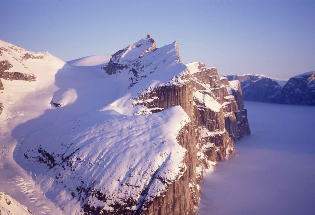 Midnight sun illuminates the peaks and cliffs of the south side of Gibbs Fiord, Baffin Island 1994 Sandy Briggs photo.