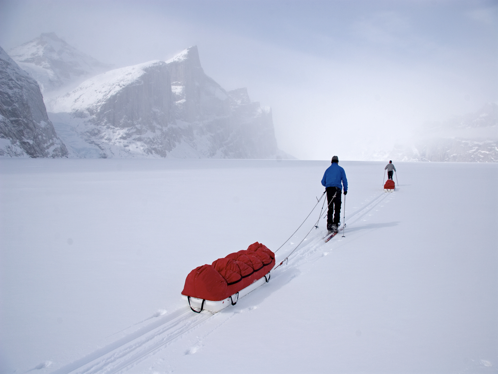 Paul van Peenen and John Dunn skiing up Gibbs Fiord, eastern Baffin Island 2007 – Sandy Briggs photo.
