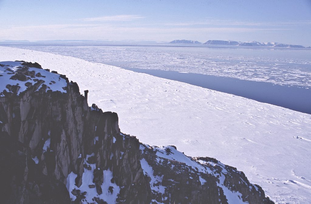 View of the ice edge, Lady Ann Strait, and distant Coburg Island from northeast Devon Island, 1998 – Sandy Briggs photo.