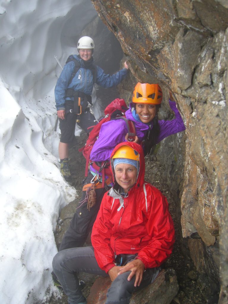 Janelle, Roxy and Val taking a break beside a crevasse 2012 – Lindsay Elms photo.