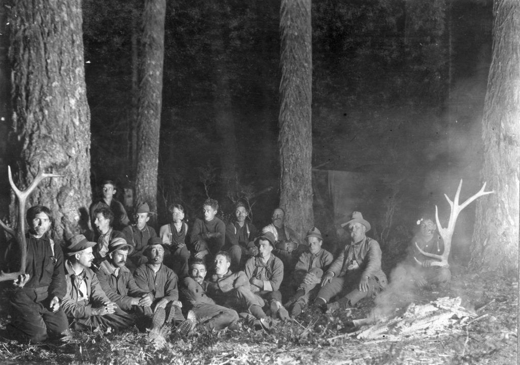 1910 Crown Mountain expedition members sitting for photo 